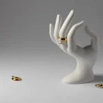 expensive-golden-ring-with-human-hand-stand-display